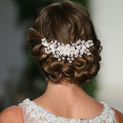 This stunning Romantic Bridal headpiece with flowers and blush beads adds style & sophistication. This chic and stylish comb embellished with ivory clay flowers and soft pearlescent beads on a silver finish. Hand wired onto a silver comb