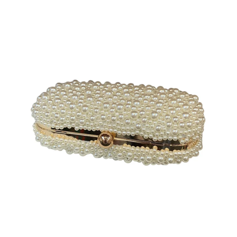 1422 cream beads with gold spine 2 Elegant cream pearl bridal clutch with gold hinge. A luxurious pearl-beaded wedding purse perfect for brides, bridesmaids, and formal evening events.