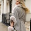 Back view of Pia Rossini faux suede cape in herringbone weave