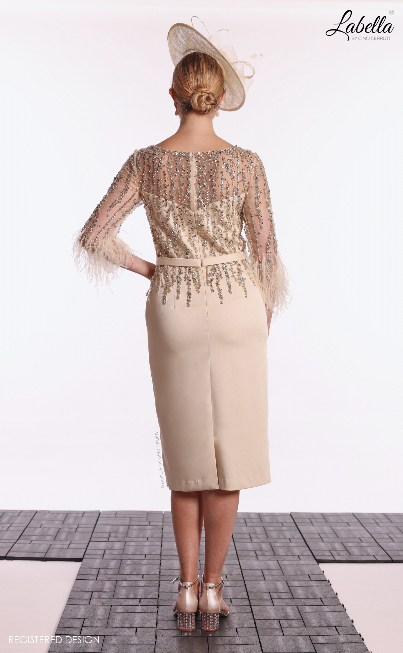 Back view of the champagne dress with sparkly sheer back and back split Back view of the champagne dress with sparkly sheer back and back split