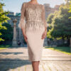 Gino Cerruti Eve champagne mother of the bride dress with feather sleeves, full-length front view Gino Cerruti Eve champagne mother of the bride dress with feather sleeves, full-length front view