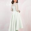 Back view with covered buttons and a dipped hem