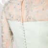 Covered buttons and keyhole on the back of the lace dress
