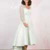 Side view showing the dipped hem of the mint green dress